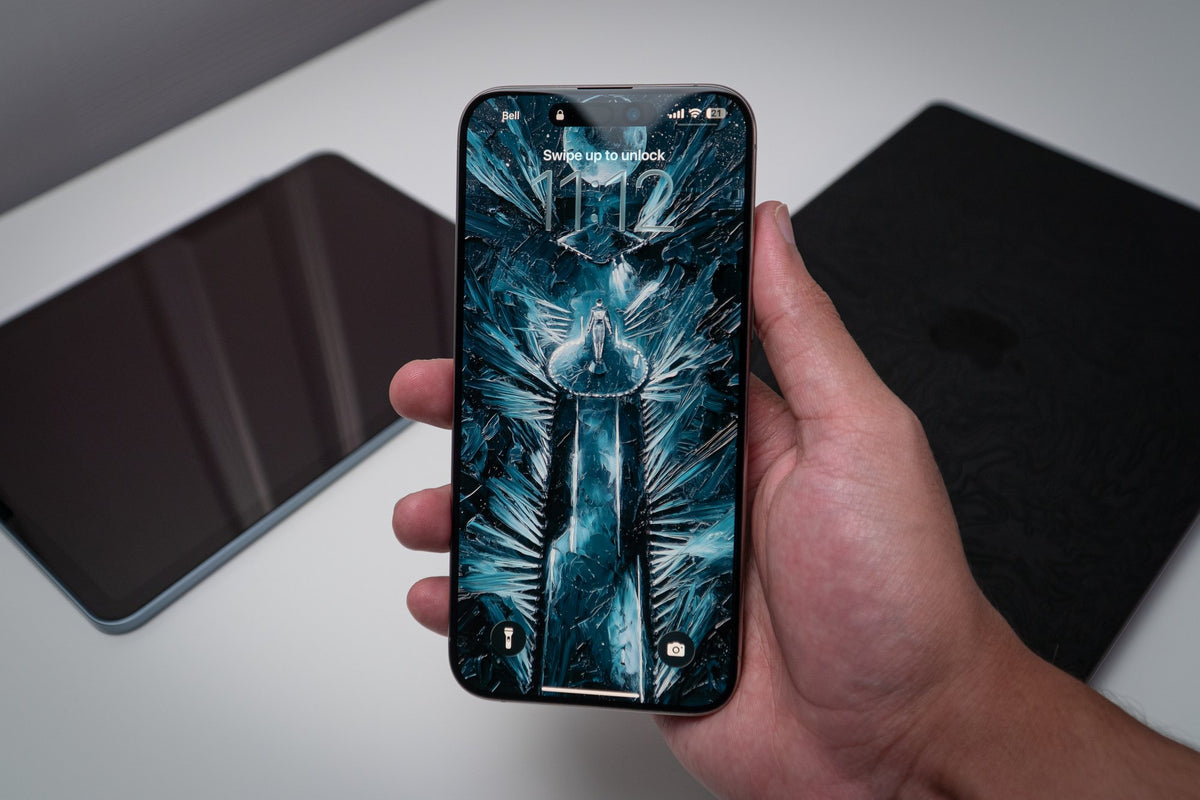 Icy blue figure with blade, wallpaper on an iPhone lock screen, held in hand